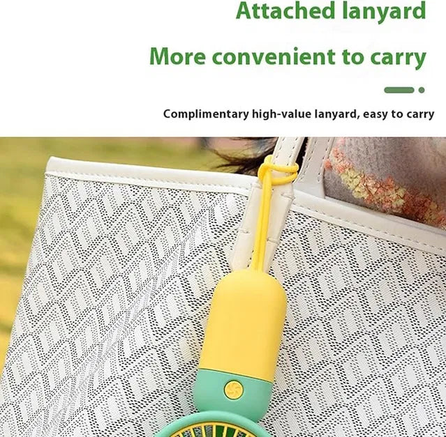 Yellow and green handheld device with attached lanyard on a white background